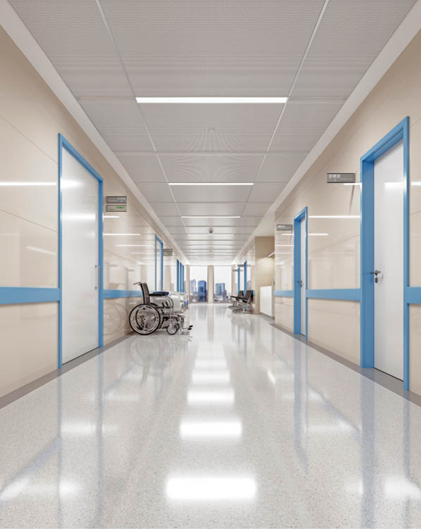Corridor of an empty modern Japanese hospital with Japanese and English signages.