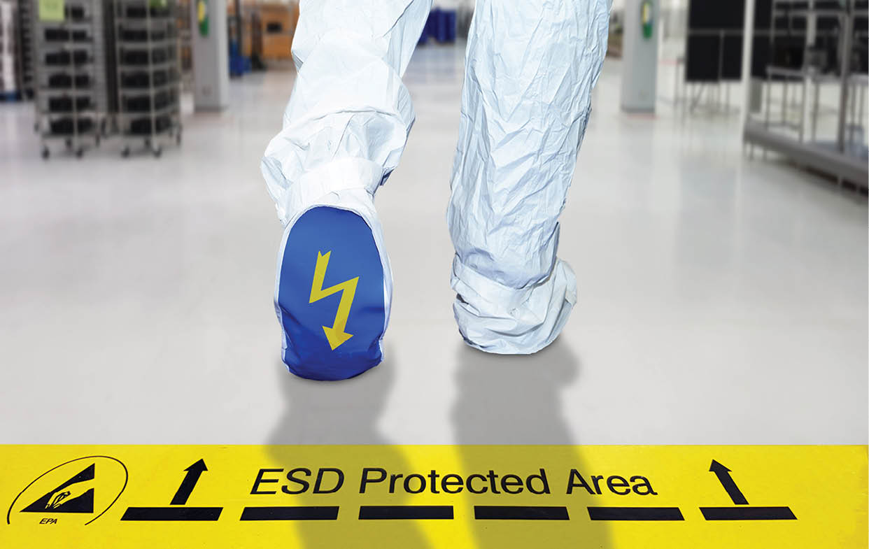 Man walking on a electrostatic control floor and cleanliness control suit with ESD symbol on the foot, A yellow tape with text: “ESD Protected Area" to be careful when entering the ESD area.