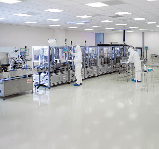 Shot Of Sterile High Precision Manufacturing Laboratory where Scientists in Protective Coverall's Use Computers and Microscopes, doing Pharmaceutics, Biotechnology and Semiconductor Research.